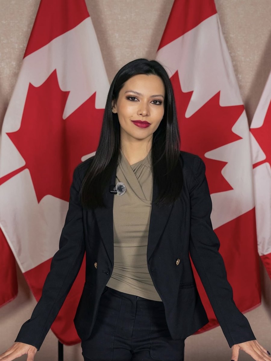 Rachel Dragas at the podium, backed by Canadian flags, at Pierre Poilievre's 2026 press conference